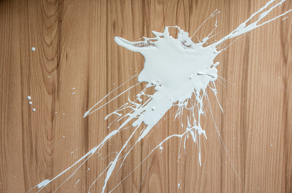 Paint spill on hardwood floor.