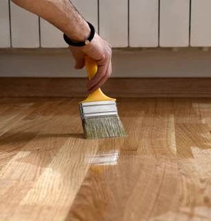 Applying wood oil finish to wood flooring