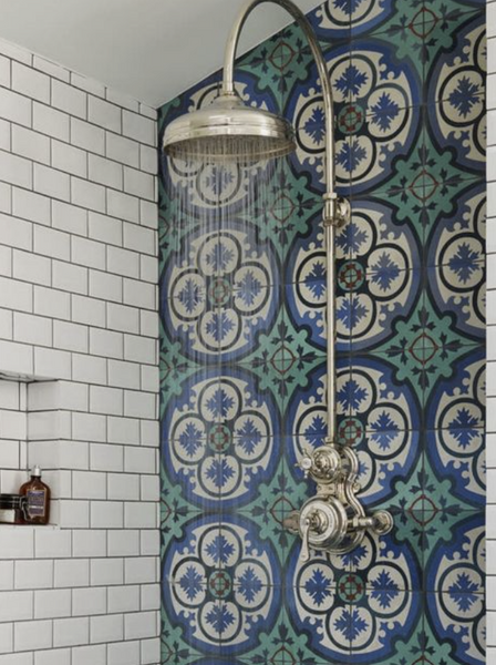 whole wall of rich green and cream pattern tile