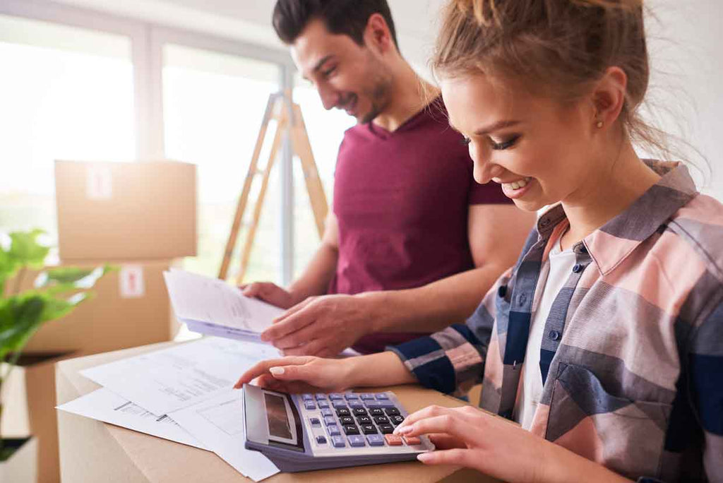 happy couple checking budget 