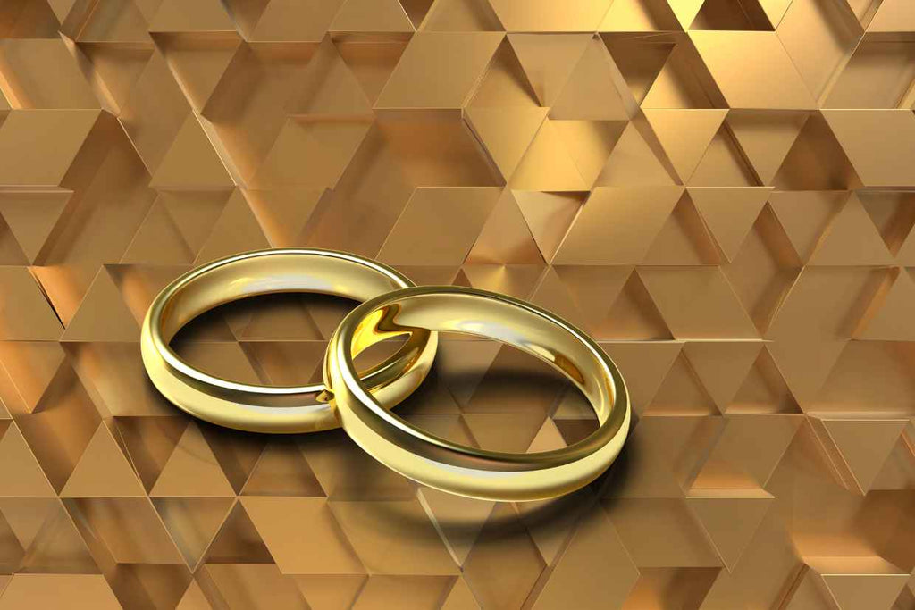 Gold rings in gloden background