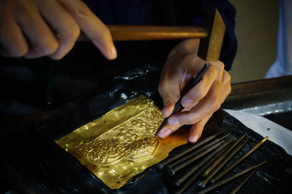 Person making gold by hand