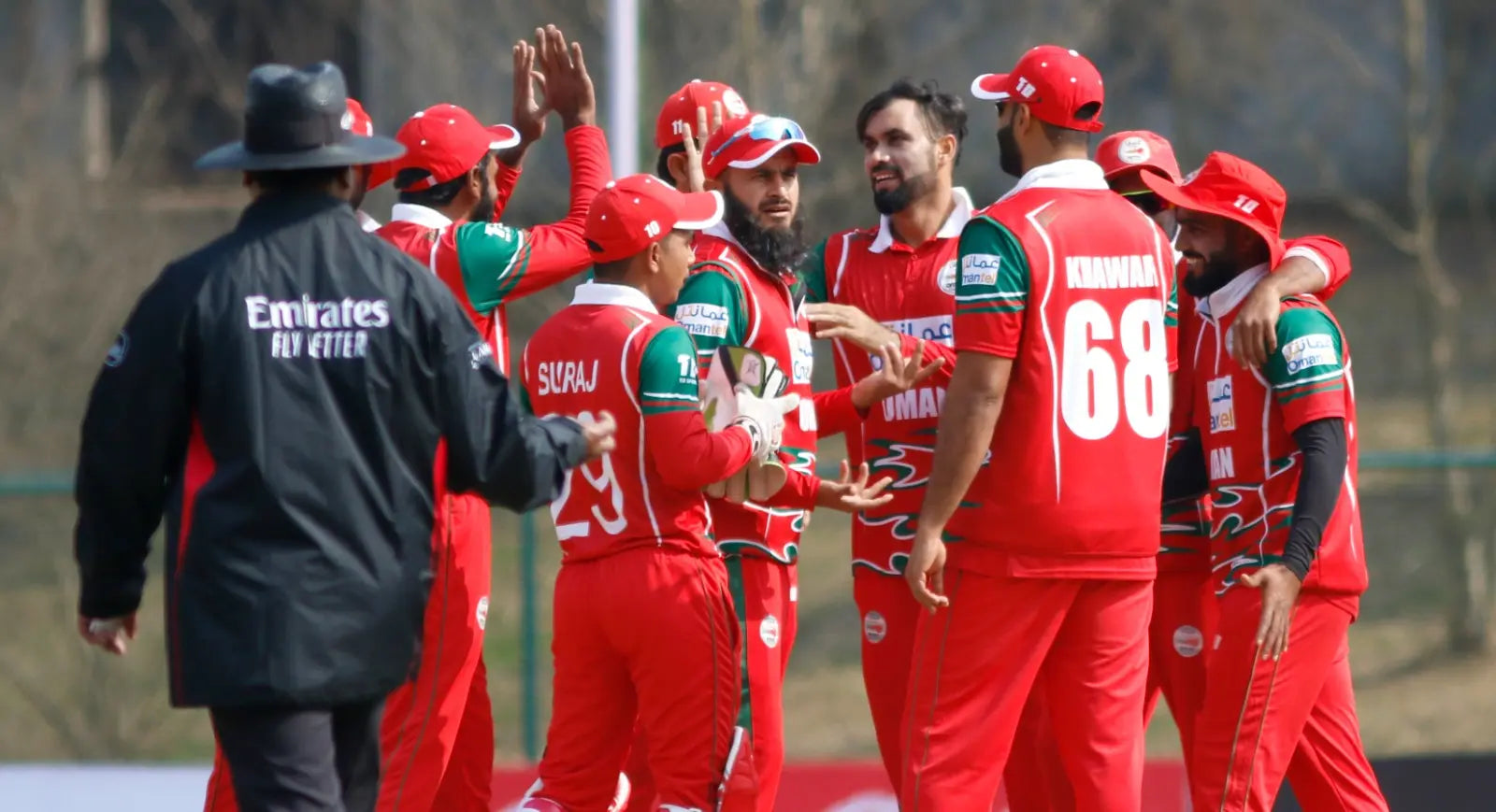 The Oman National Cricket Team players celebrate a wicket