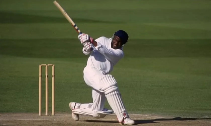 A Young Brian Lara smacks the ball out of the park in a county championship game