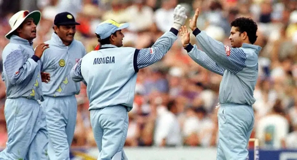 Sachin Tendulkar and other Indian players celebrate a wicket