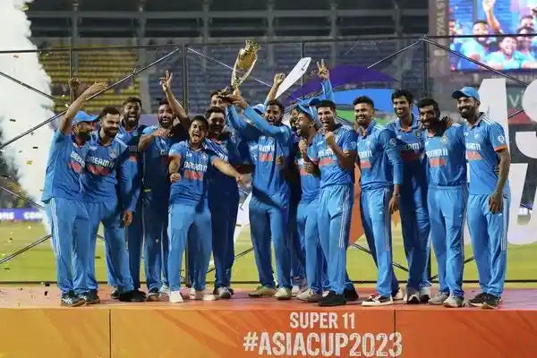 The Indian Cricket Team celebrate winning the Asia Cup 2023 trophy at the centre stage under Rohit Sharma's captaincy