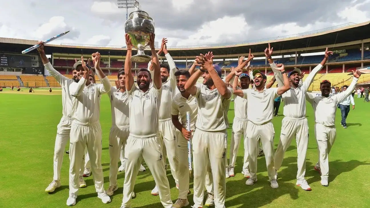 The Madhya Pradesh state players celebrate with the Ranji Trophy
