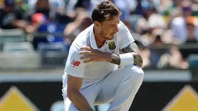 Dale Steyn holds his shoulder as he suffers a shoulder injury