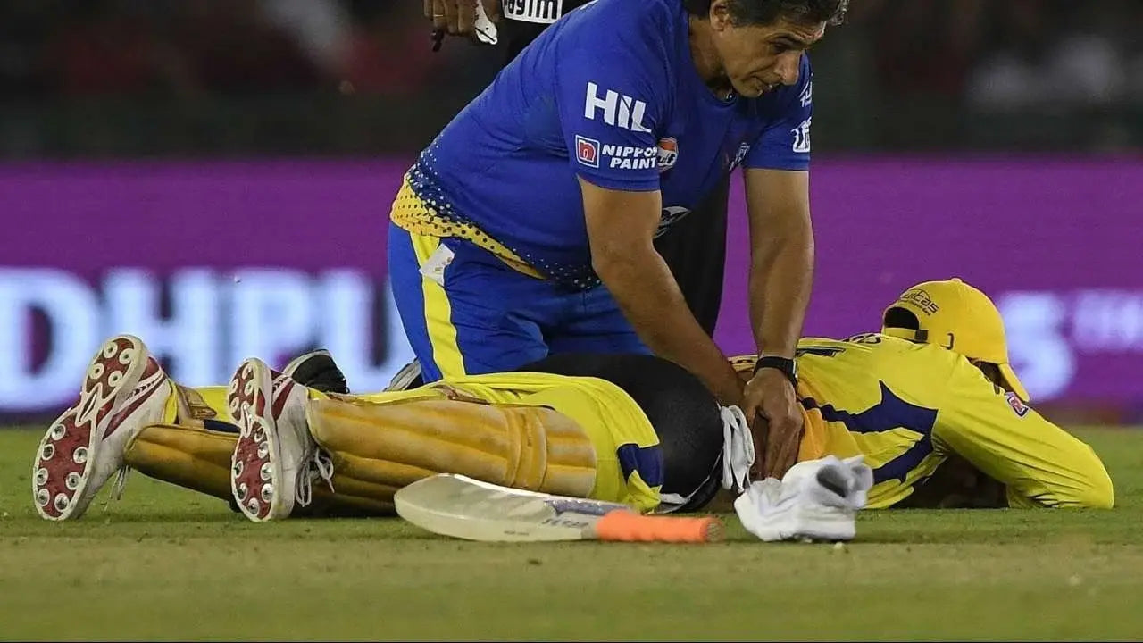 MS Dhoni gets a back massage mid match due to his back injuries