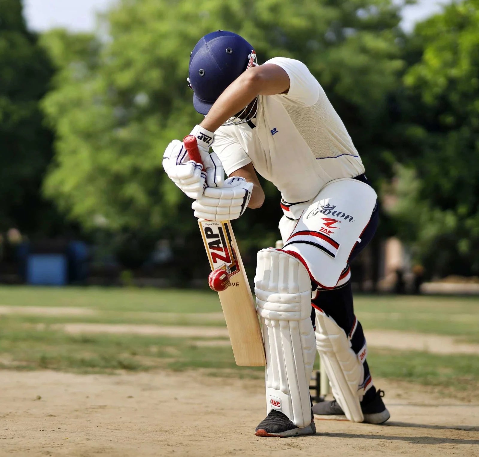 A ZAP Athlete bats with the entire ZAP Cricket Batting Protection: Pads, helmet, gloves, thigh pads