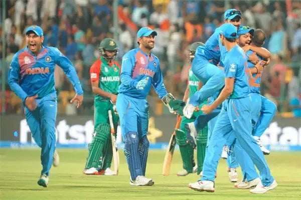 Indian Cricket Team celebrates a win over Bangladesh in the 2016 ICC T20 World Cup Final at the Chinnaswamy Cricket Stadium
