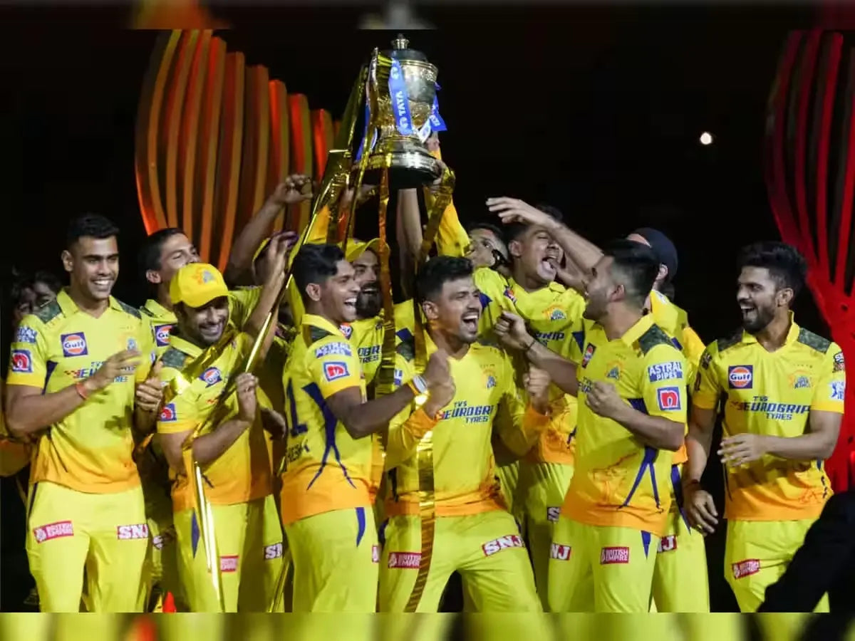 The Chennai Super Kings team celebrate with the trophy after the 2023 IPL Final