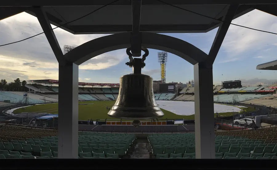 The bell at the Eden Gardens Cricket Ground overlooking the magnificent ground and stadium