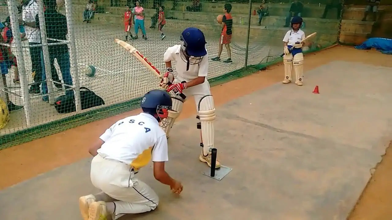 A player doing the Tee Cone Batting Drill