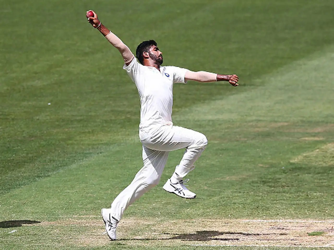 Jasprit Bumrah doing his bowling actions while coming into bowl