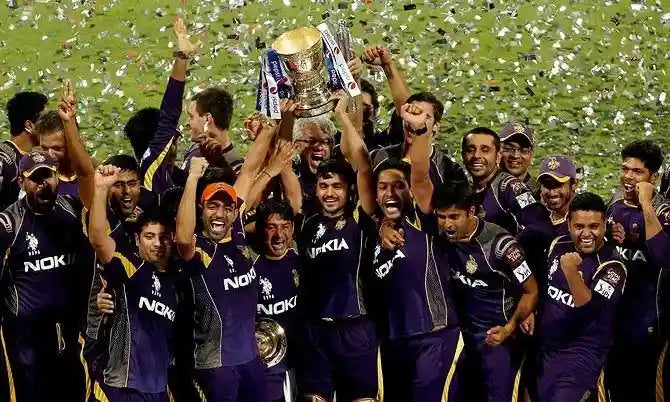 Kolkata Knight Riders players celebrate winning the IPL Trophy