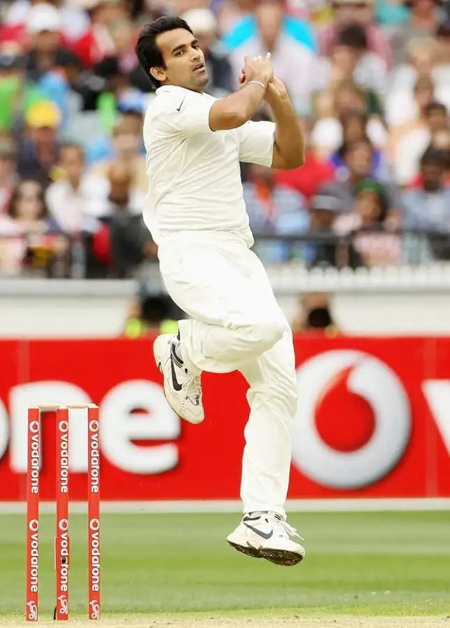 Zaheer Khan takes a does before doing his bowling action and bowling a swinging delivery