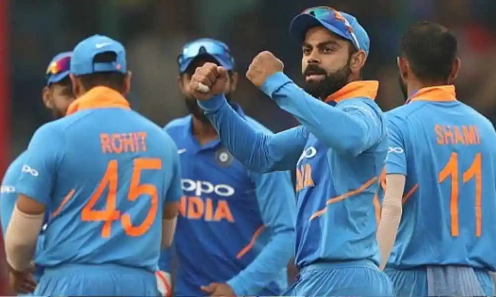 Indian players celebrate a wicket in the 2019 Indian team jersey