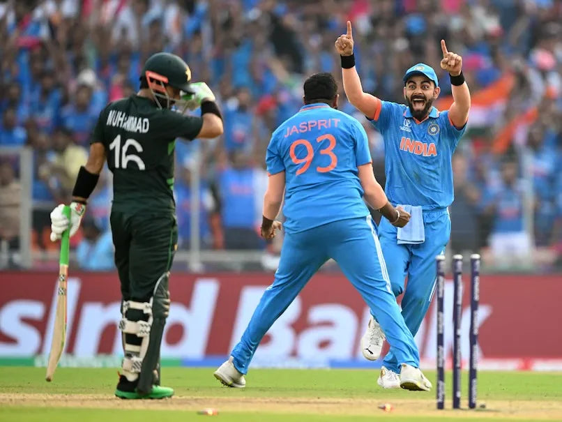 Virat Kohli and Jasprit Bumrah celebrate Mohammad Rizwan's wicket in the India vs Pakistan 2023 Cricket World Cup Match