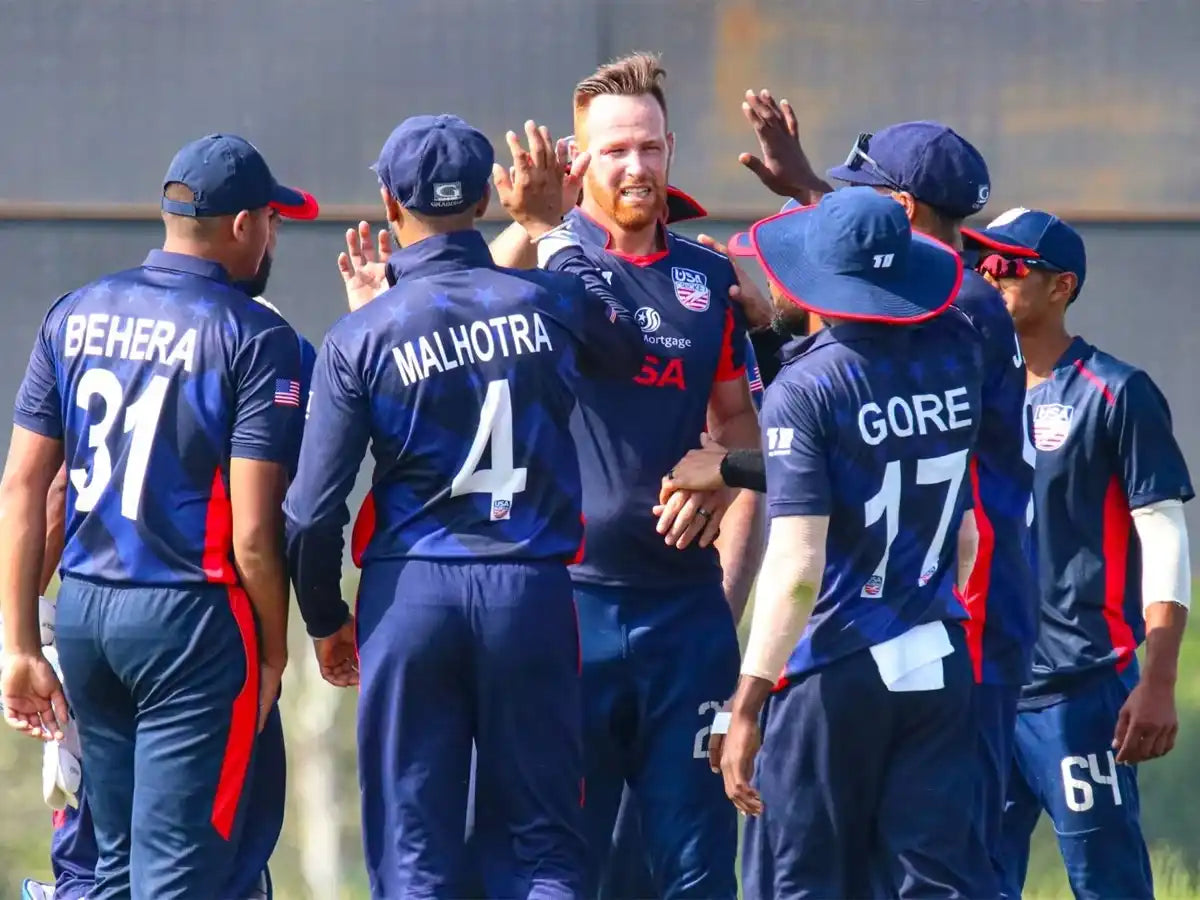 The United States of America Cricket Team players celebrating a wickets together