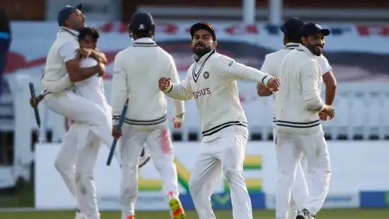 Virat Kohli celebrating a test match victory as Indian's captain