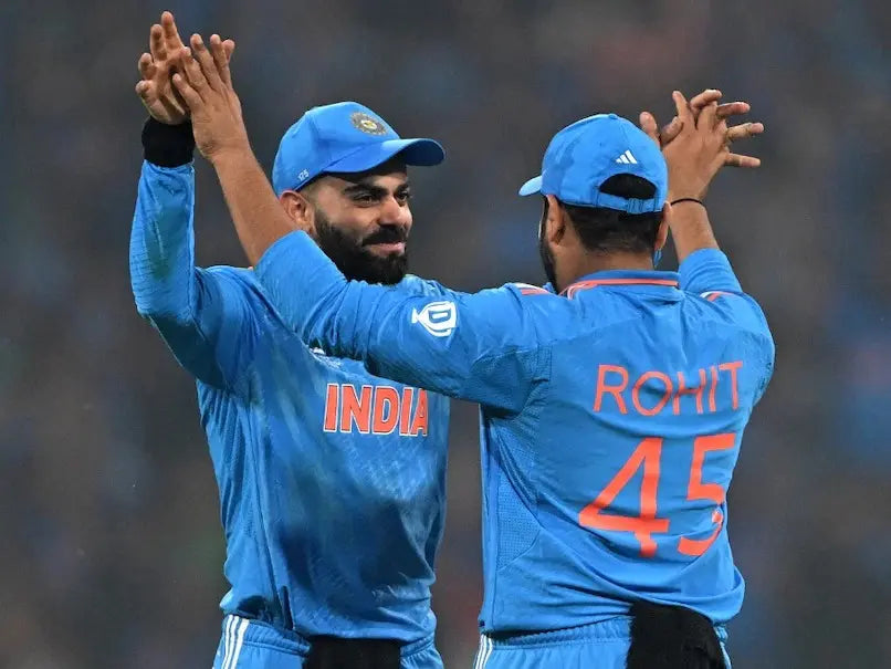 Virat Kohli ans Rohit Sharma celebrate a wickets during the 2023 ICC ODI World Cup Trophy