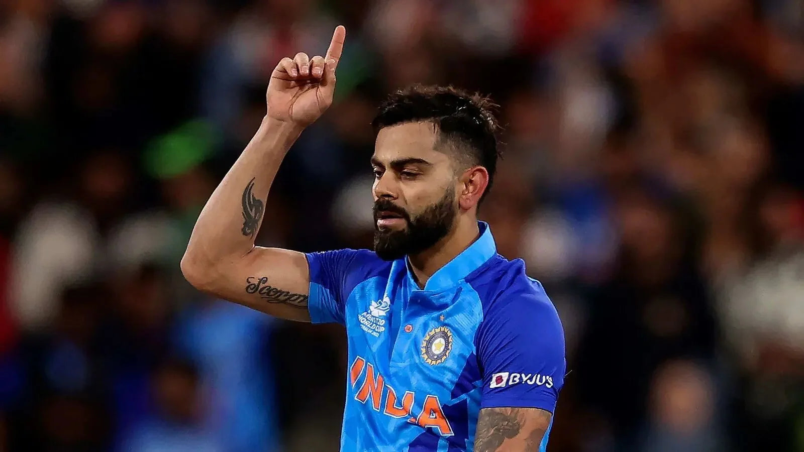 Virat Kohli points to the sky to celebrate India's win vs Pakistan