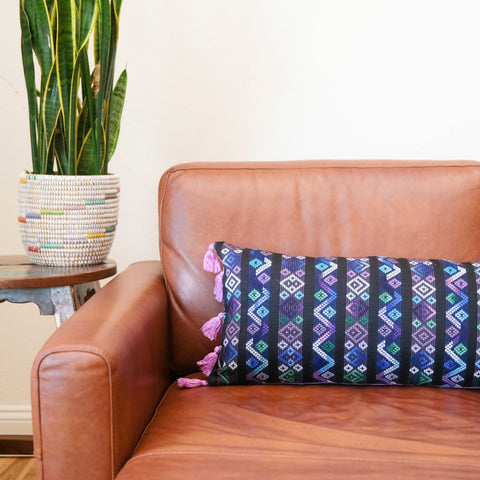 Violet Lumbar Pillow Resting on a Chair