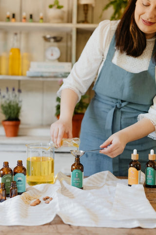 woman blending essential oils