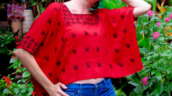 Model with Guatemalan red Huipil