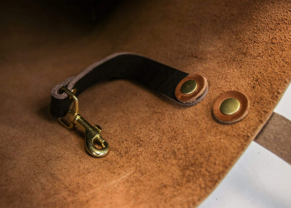 This customizable hand made leather good by Kerry Noël features a keychain loop so you'll never have to dig in your bag again!