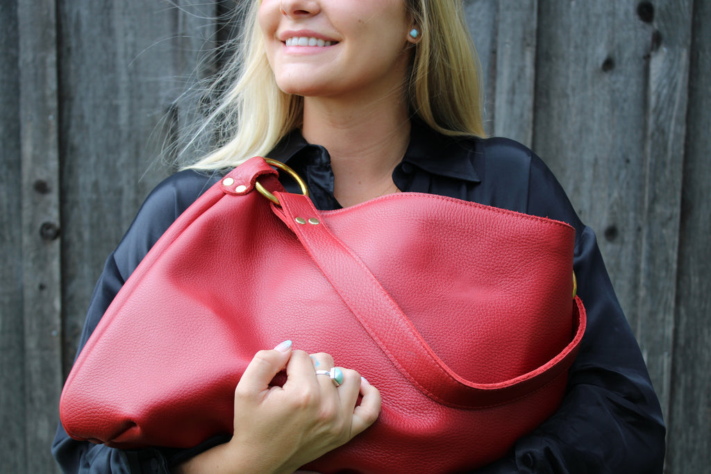 The Kerry Noël Genuine Leather Handbag Made in USA  is durable and soft! This brightly colored red hobo is available on kerrynoel.com