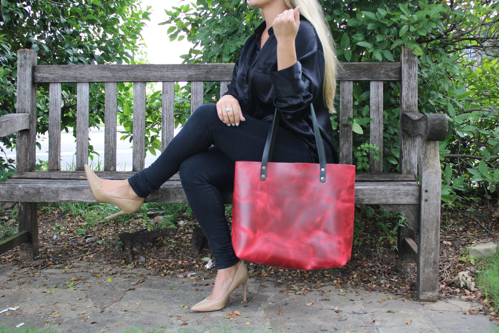 The Kerry Noël Genuine Leather Tote Made in USA features a spacous main compartment! This brightly colored red tote is available on kerrynoel.com