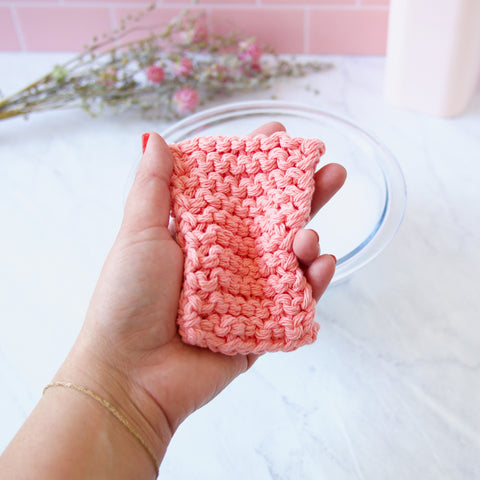 Reusable Pink Cotton Sponge in a hand
