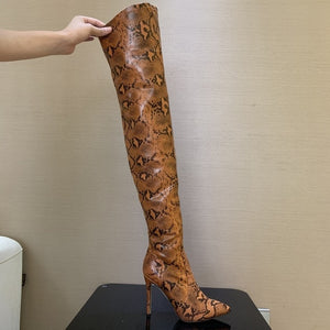 snakeskin high knee boots