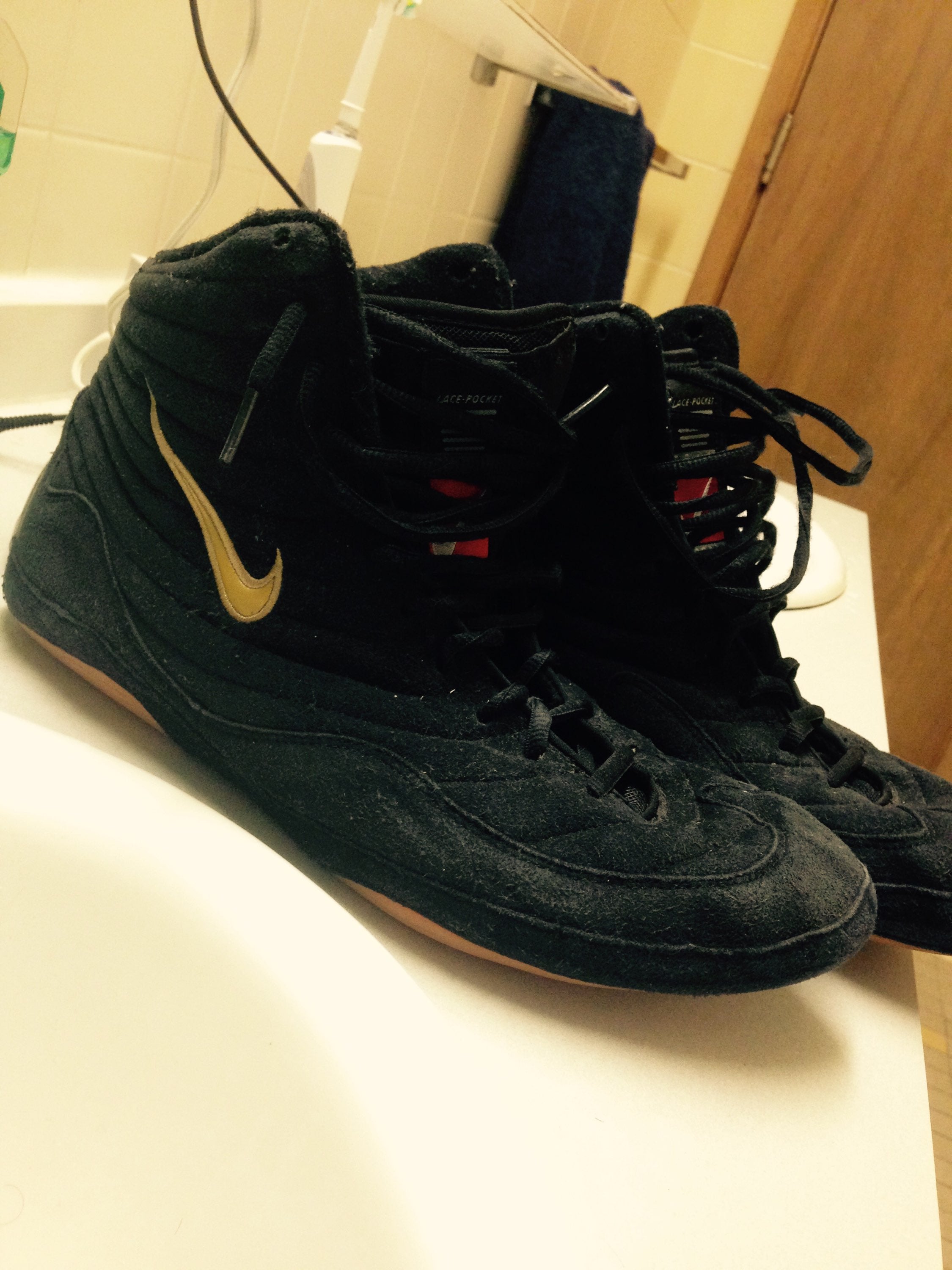 nike inflict black and gold