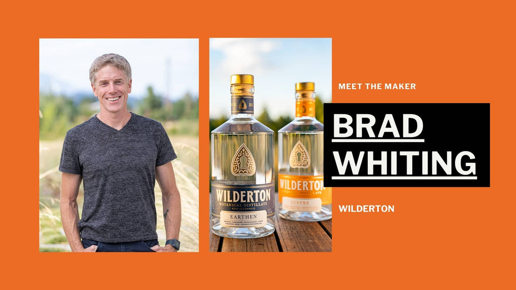 Close up photo of Brad Whiting and 2 Wilderton alcohol-free spirits bottles against an orange background