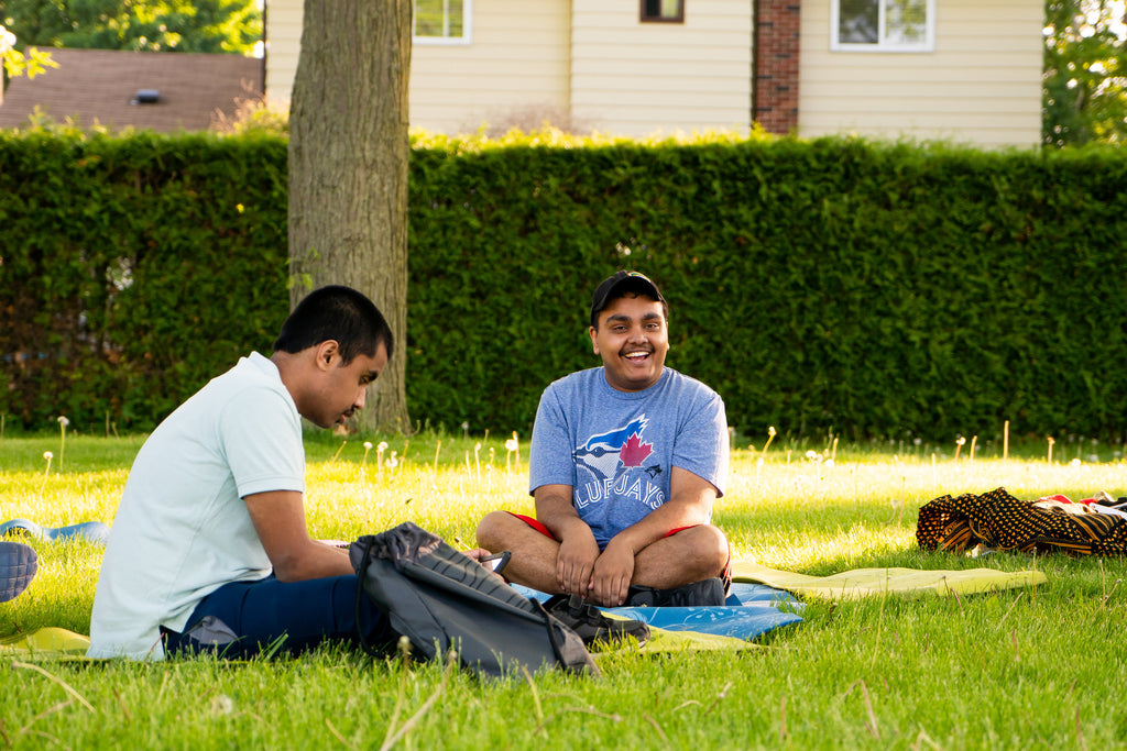 Kevin Solomons sitting on the grass