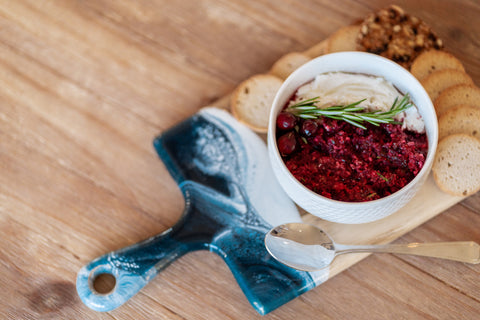 Cranberry salsa served on a resin accented cheese board