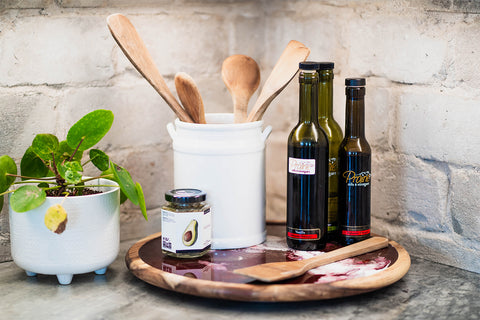 Cooking oil wooden spoons and a spice jar on an epoxy resin Lazy Susan.