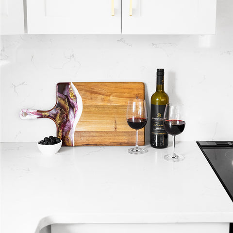 Red Merlot resin Large acacia cheese board in white kitchen served with wine