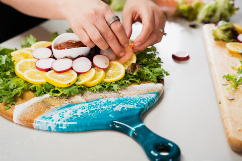 placing fresh radishes on top of the lemon slices