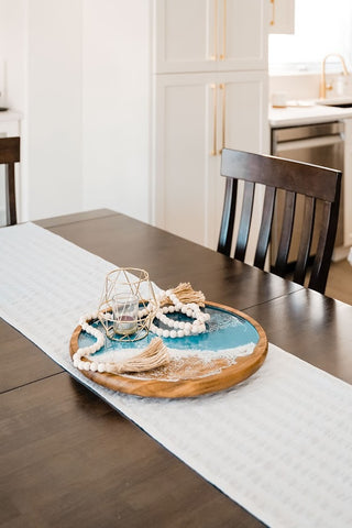 resin ocean inspired lazy susan on a kitchen table used as a centrepiece 