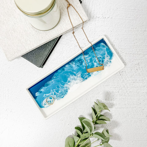 ocean designed ceramic resin tray with jewlery on it