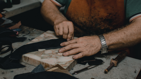 A person working with leather