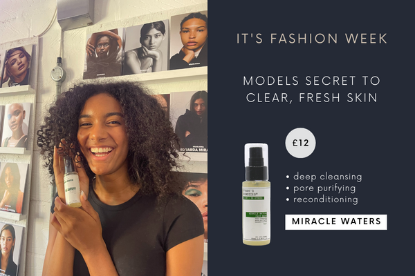 fashion week picture. model holding face wash for clear skin, clear spots