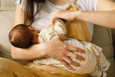 Mother breastfeeding a newborn
