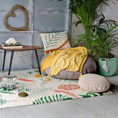 You may find yourself loving the Botanic Plants Rug, influencing the color of the furniture you choose.