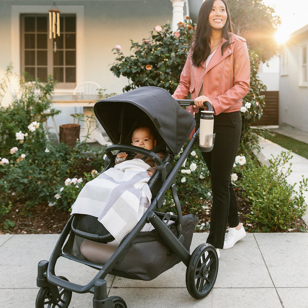 women pushing vista v2 stroller while child in the stroller -- Color_Jake