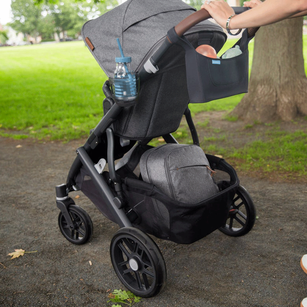 back side view of vista v2 stroller on the street-- Color_Greyson